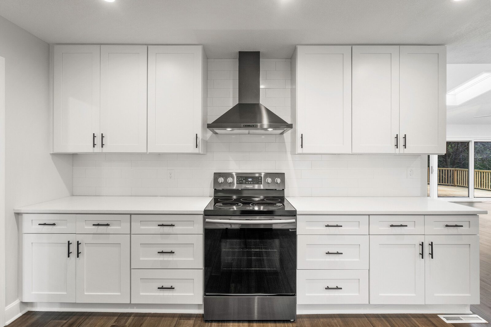 Nova Homes crew on site during a remodel, materials staged, wide horizontal shot