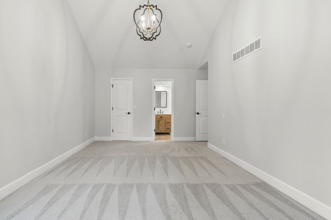 Walk in tile shower with glass enclosure and bench